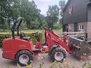 Schäffer 2336 2336 met bak en mestklem (bj 2009)