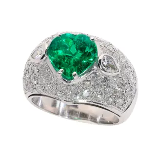 A Bold Vintage Ring with a Colombian Emerald Heart and Diamonds, circa 1990
