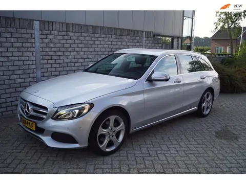 Mercedes-Benz C-klasse Estate 180 Ambition Autom Half Leder/Stof Sportst Stoelverw Navi Clima Cruise