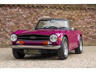 Triumph TR6 Overdrive "In Magenta" "In Magenta" - AI says": psychedelic purple-pink that stands out 