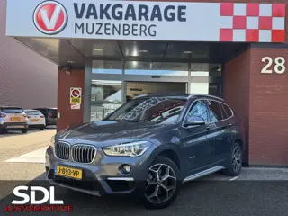 BMW X1 xDrive20i Executive // PANO / SCHUIF- KANTELDAK // NAVI // PDC V+A // CRUISE // TREKHAAK // E