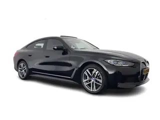 BMW i4 eDrive40 High Executive 84 kWh [3-Fase-11kW] {SoH-98%} (INCL.BTW) *PANO | HEAD-UP | LEATHER |