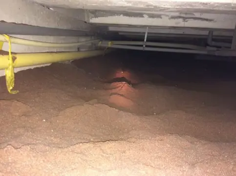 Kruipruimte ophogen met zand / schelpen / isolatiechips