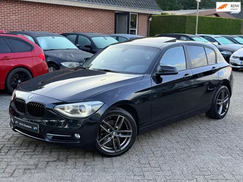 BMW 1-serie 116i Executive Sport|Nieuwe Ketting + Klepseals|Dakje|Cruise control|Navigatie|Xenon|Net