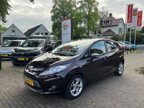 FORD FIESTA 1.4 GHIA AUTOMAAT 5-DEURS / AIRCO / RADIO-CD / ELEK. RAMEN / 15'' LM-VELGEN
