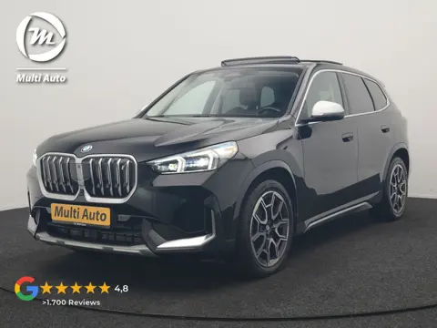BMW iX1 xDrive30 X Line 67 kWh 313pk Dealer O.H. | Trekhaak Af Fabriek | Panodak | Head Up | Adaptiv
