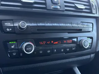 Foto 14 van BMW 1-serie 114i EDE | Stoelverwarming | Leder | Bluetooth | Navi | Cruise