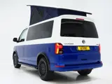 Foto 26 van Volkswagen California 2.0 TDI T6.1 4Motion DSG All Terrain | Slaaphefdak | Draaistoelen | Koelkast |