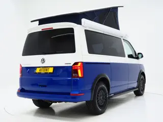Foto 11 van Volkswagen California 2.0 TDI T6.1 4Motion DSG All Terrain | Slaaphefdak | Draaistoelen | Koelkast |