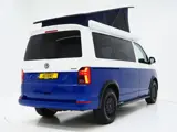 Foto 21 van Volkswagen California 2.0 TDI T6.1 4Motion DSG All Terrain | Slaaphefdak | Draaistoelen | Koelkast |