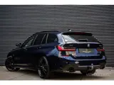 Foto 23 van BMW 3-serie Touring 330e xDrive M-Pakket 292PK|Pano|360°|HUD|Rijmodus|Tr.Haak|Sfeer|Keyless|Laser|Di