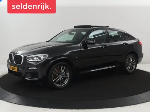 BMW X4 xDrive20i High Executive Edition M-sport | Panoramadak | Leder | Trekhaak | Camera | Sfeerver