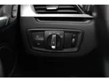 Foto 30 van BMW X1 sDrive20i Orange Edition II / 69.961 km / Trekhaak / Panoramadak / Camera / Head-up / Leder /