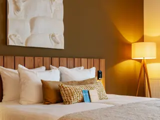 Deluxe kamer met regendouche en terras in Boutique Hotel Texel