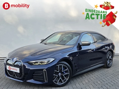 BMW i4 M50 High Executive M-Sport 84 kWh 'Tansanitblau' SOH 96% NL Auto! | 360 Camera | Hifi | DAB |