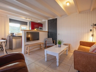 Appartement met privéterras en omheinde tuin vlak bij het strand