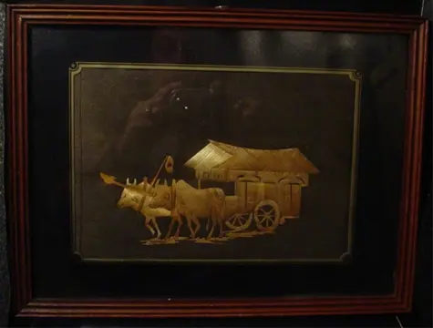 Reliefschilderij van riet.Indonesia, jr. '30,karbouw met kar
