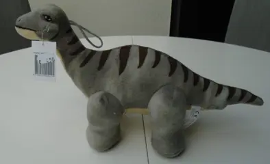 KNUFFEL DINO GRIJS NIEUW.