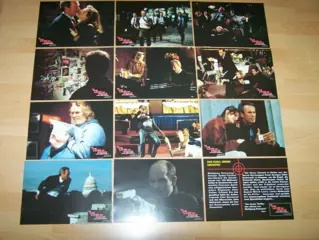 IN THE LINE OF FIRE lobbycard set.