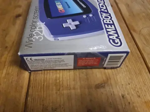Original Gameboy Advance Purple Edition - Complete with insert, manuals Sealed on 1 side, In Perfect - Console - In originele verpakking