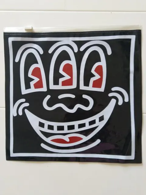 Keith Haring (1958-1990) - Keith Haring 3 Eyed Face ziplock bag red and black, 2 pencil cased ziplock red and blue
