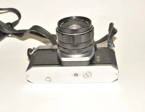 Pentax Asahi SP 500 met Super-Takumar 2/55mm + 28mm + 135mm + tussen ringen-converter-boeken etc.