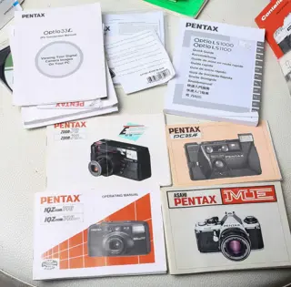 Très gros lot de Modes d'emploi : Nikon , Canon , Minolta , Pentax , Rollei , Olympus ect ...
