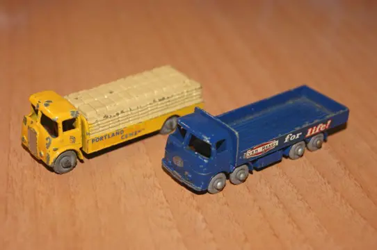 A Moko Lesney Product "Matchbox" 1-75 Regular Wheels Series - 1:76 - First Original Moko Series 8-Wheeled E.R.F. "EVER READY" 686 Stake Truck no.20b - 1959 - Albion Chieftain "PORTLAND" Cement Truck no.51a - 1958